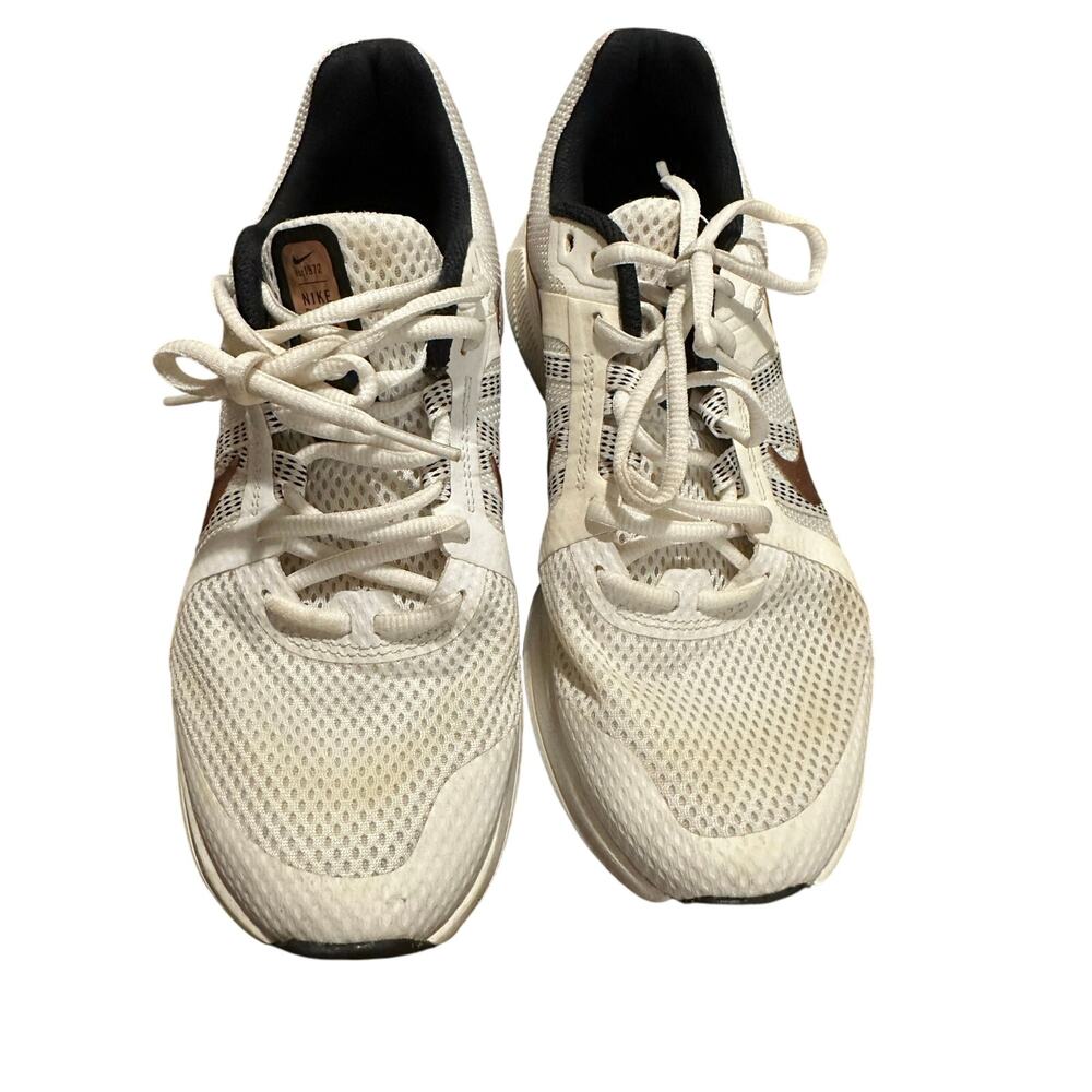 Nike Women's Run Swift 2 running sneakers in a white colorway rose gold accents